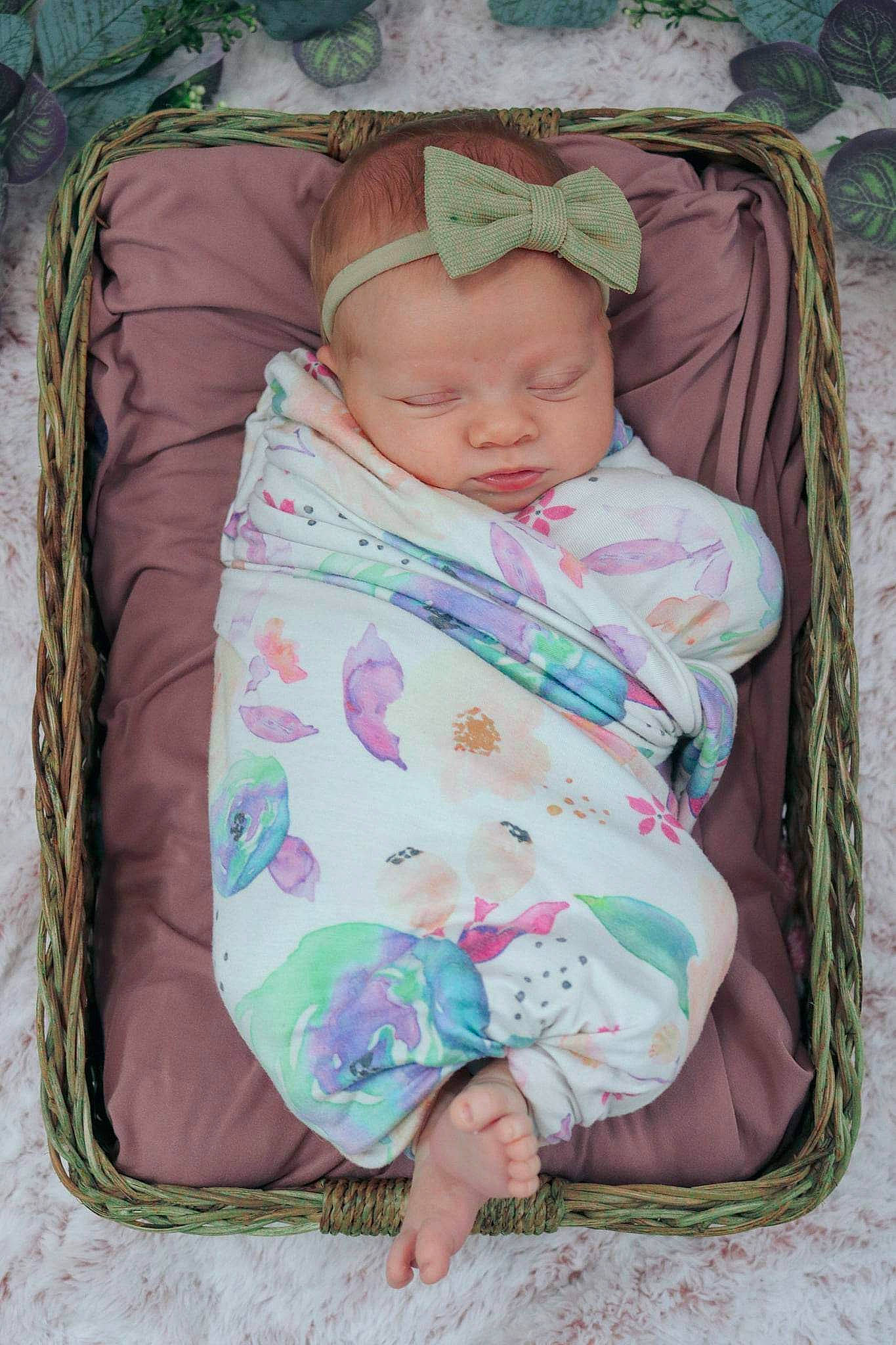 Ember is registered to the contest to win money with this photo: baby, baby_products, baby_safety, baby_sleeping, baby_toddler_clothing, bedtime, cheek, child, comfort, face, head, infant_bed, linens, pattern, person, pink, room, sitting, skin, sleeve