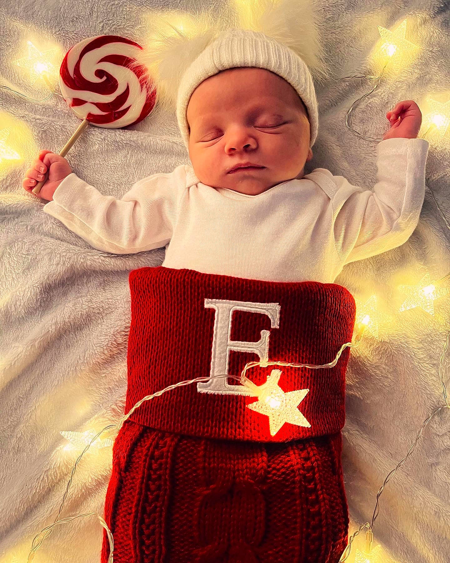 Ember joined the competition — help win amazing prizes! baby, baby_sleeping, baby_toddler_clothing, child, christmas, christmas_eve, christmas_ornament, event, fictional_character, happy, holiday, linens, outerwear, pattern, person, red, santa_claus, sleeve, t_shirt, toddler