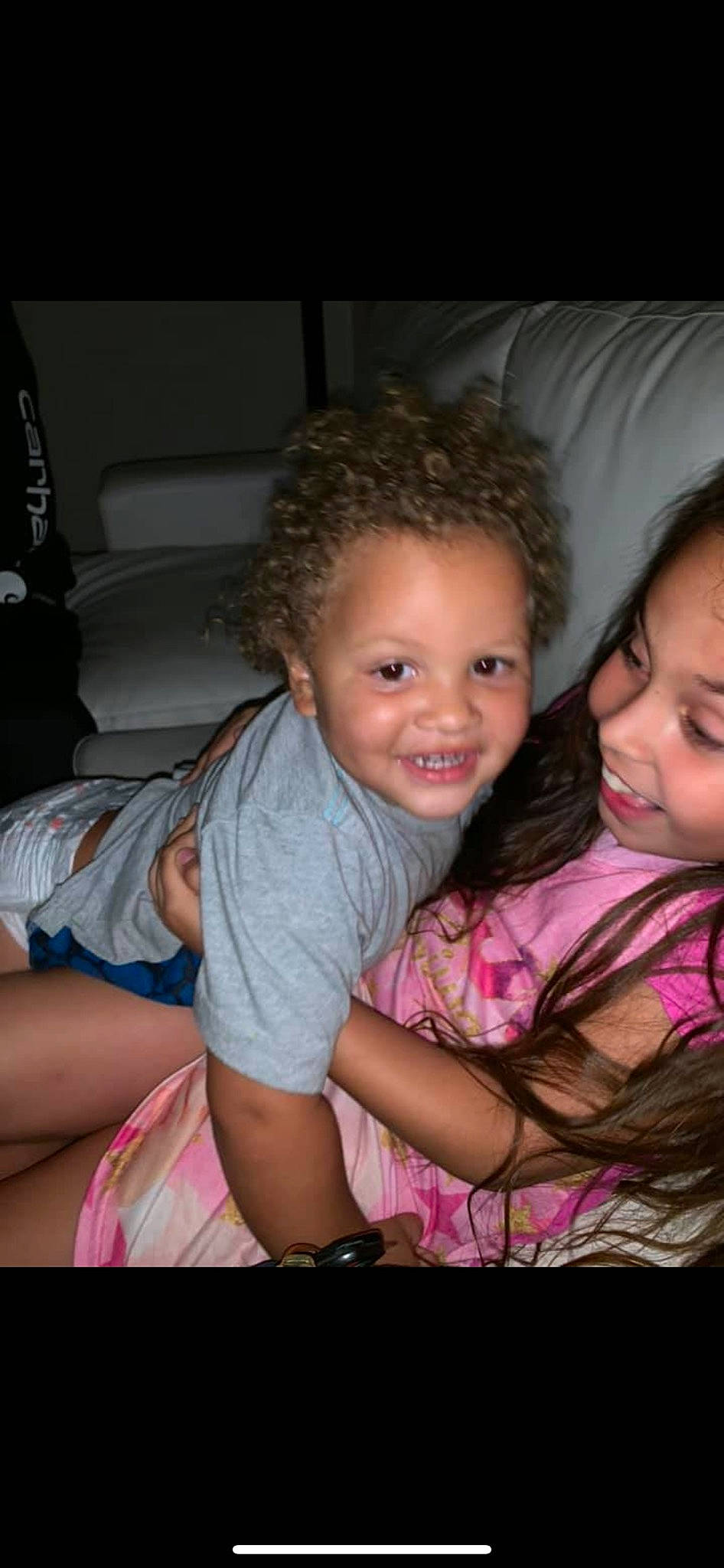 Jackie is registered to the contest to win money with this photo: blond, brown_hair, cheek, child, daughter, eye, face, fun, happy, interaction, iris, joy, mother, mouth, person, pink, sibling, sitting, skin, smile