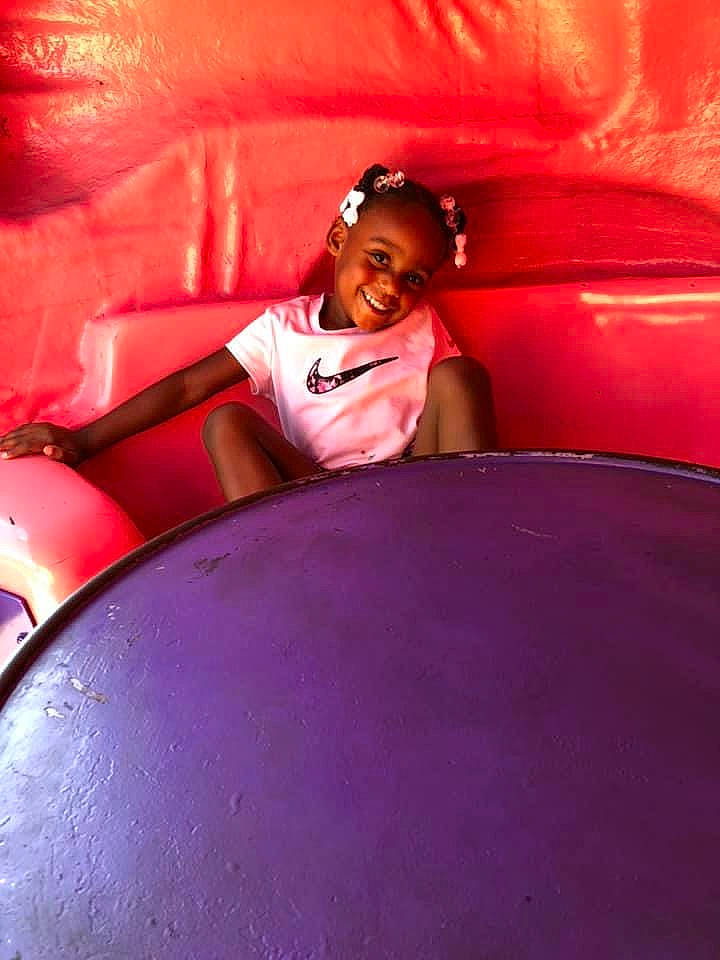 London is registered to the contest to win money with this photo: fun, joy, leg, magenta, person, pink, purple, red, textile