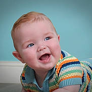 Luca joined the competition — help win amazing prizes! baby, background, blue_eyes, cheeks, child, clothing, crawling, cute, expression, hair, happy, head, indoor, infant, person, portrait, skin, smiling, striped_clothing, sweater