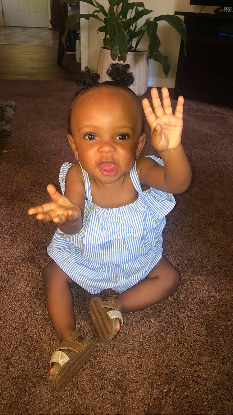 Janiyah joined the competition — help win amazing prizes! arm, baby_toddler_clothing, cheek, chin, eye, face, facial_expression, finger, hairstyle, hand, houseplant, human, joint, mammal, mouth, nose, organ, person, skin, standing