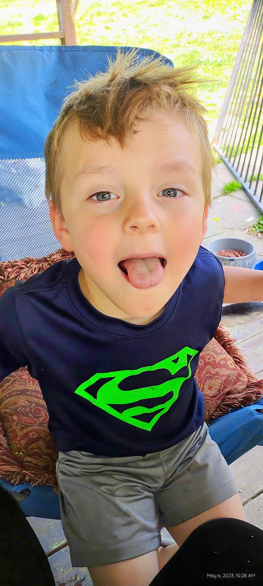 River is registered to the contest to win money with this photo: baby_toddler_clothing, cheek, child, eye, eyelash, fun, grass, happy, iris, jaw, leisure, mouth, neck, nose, person, sitting, skin, sleeve, smile, t_shirt