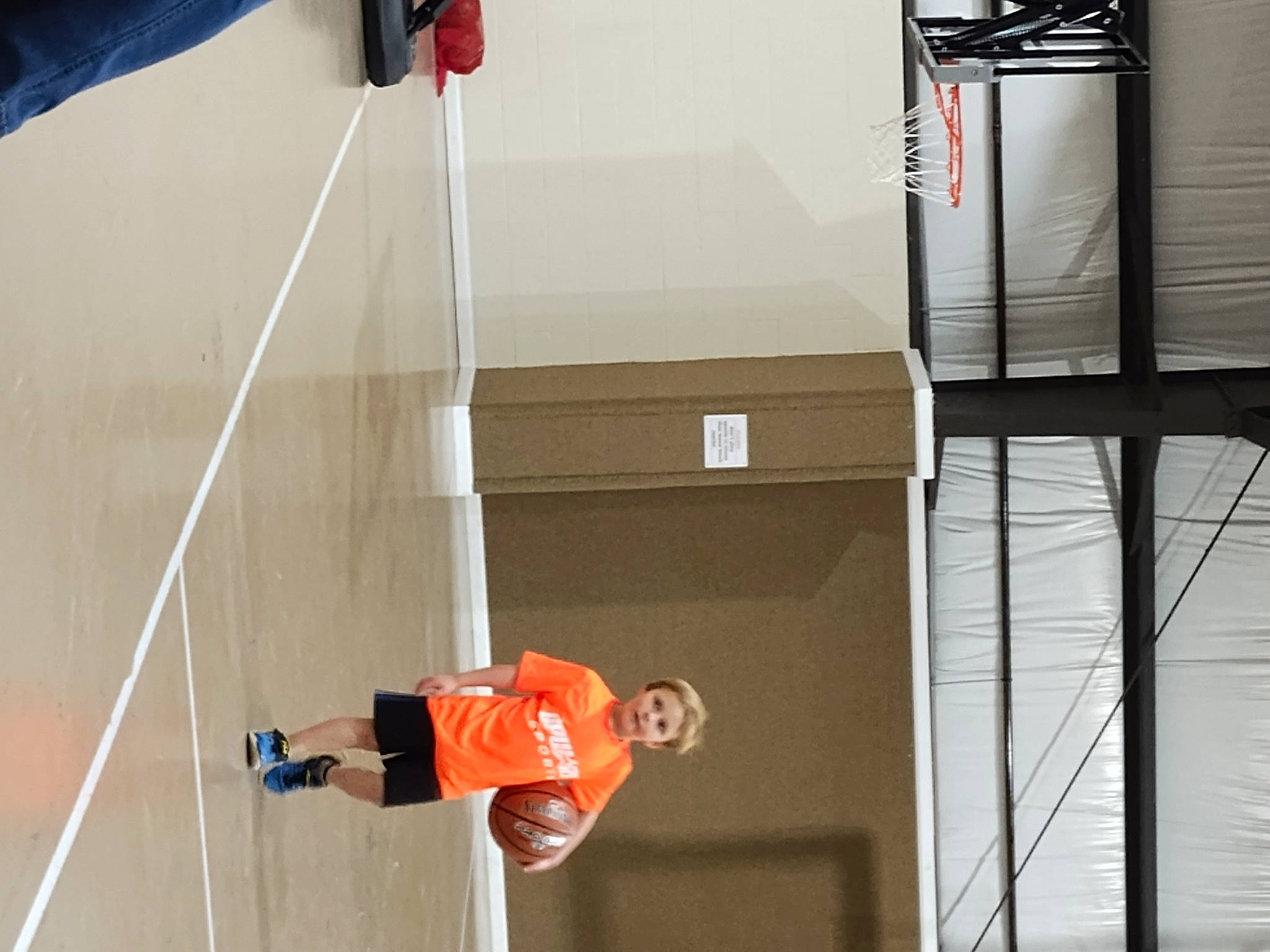 River is registered to the contest to win money with this photo: adventure, ball, ball_game, basketball_hoop, competition_event, leisure, line, net, net_sports, person, player, racquet_sport, recreation, red, room, rope, shorts, sports, sports_equipment, team_sport