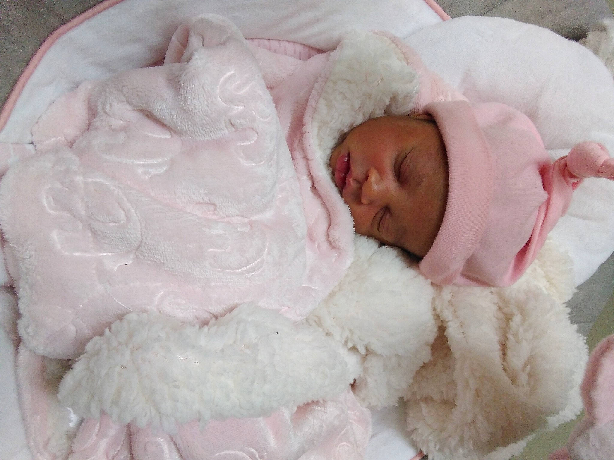 Alaysia is registered to the contest to win money with this photo: baby, baby_products, baby_sleeping, bedding, bedtime, blanket, child, fur, headwear, linens, person, pink, skin, sleep, textile, toddler