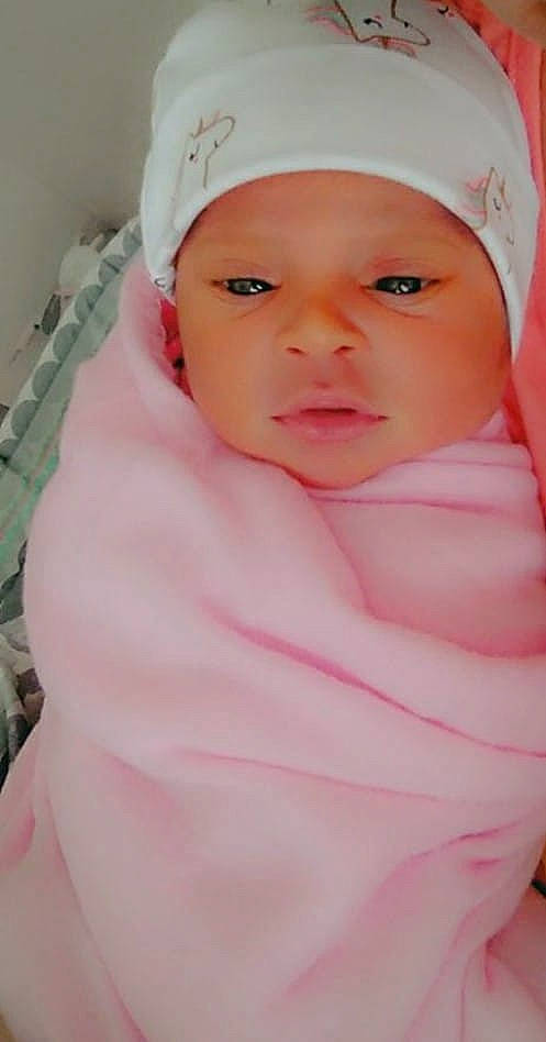 Alaysia is registered to the contest to win money with this photo: baby, cheek, child, face, forehead, head, headgear, headwear, lip, nose, person, pink, skin, smile, toddler