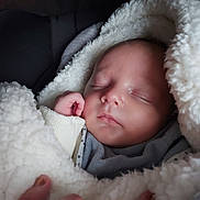 Maëlyo participe au concours pour gagner de l'argent avec cette photo : baby, sleeping, blanket, cozy, infant, soft, face, peaceful, wrapped, hand, newborn, cute, warm, closeup, portrait, child, toddler, resting, fingers, comfort