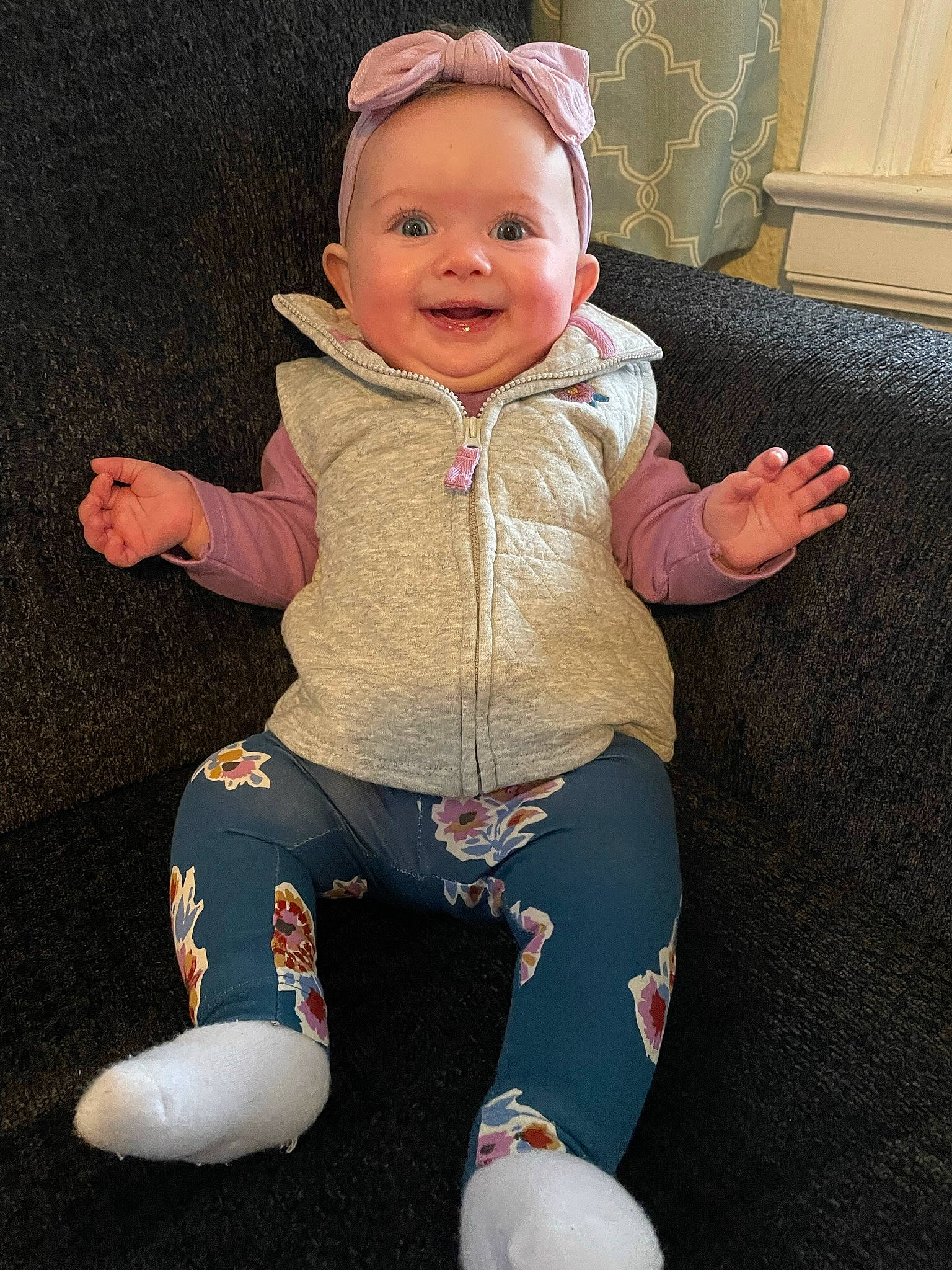 Ainsley joined the competition — help win amazing prizes! arm, baby, baby_toddler_clothing, cheek, child, eye, face, finger, fun, happy, head, human_body, joy, person, pink, sitting, skin, sleeve, smile, standing