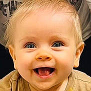 Lip is registered to the contest to win money with this photo: baby, child, smiling, happy, blue_eyes, blonde_hair, face, mouth_open, teeth, skin, clothing, portrait, cute, infant, young_child, human, expression, joy, eyes, head