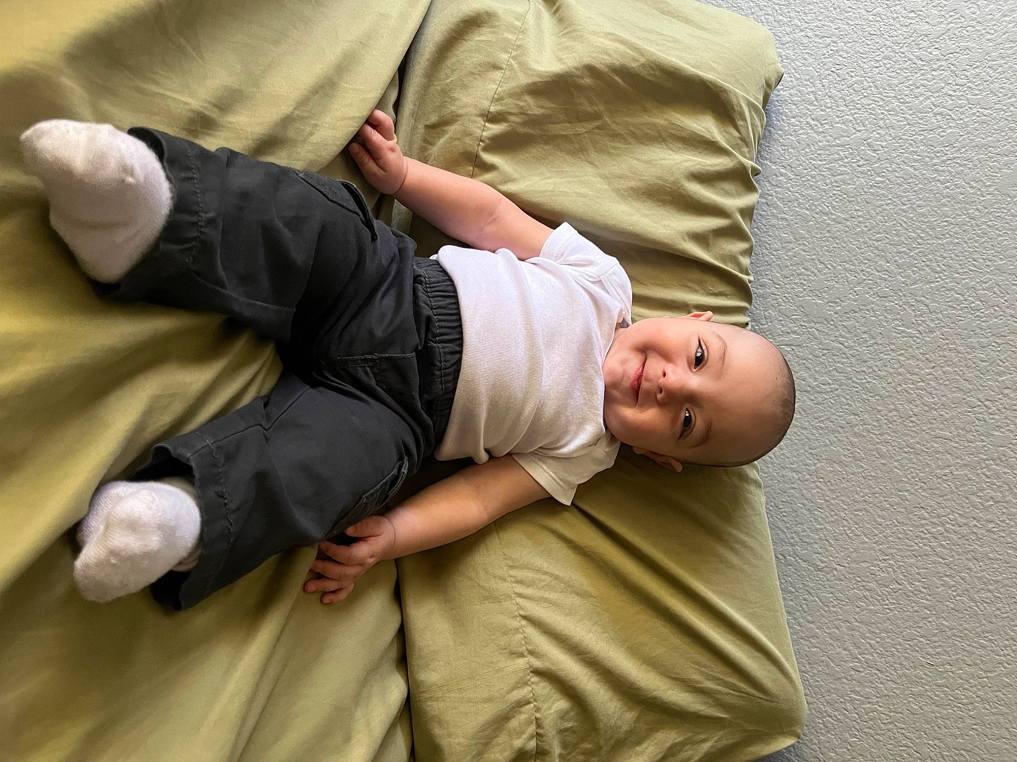 Arturo joined the competition — help win amazing prizes! abdomen, arm, baby, comfort, elbow, finger, gesture, hand, human_body, human_leg, joy, khaki_pants, knee, linens, person, sitting, sleeve, t_shirt, thumb, toddler