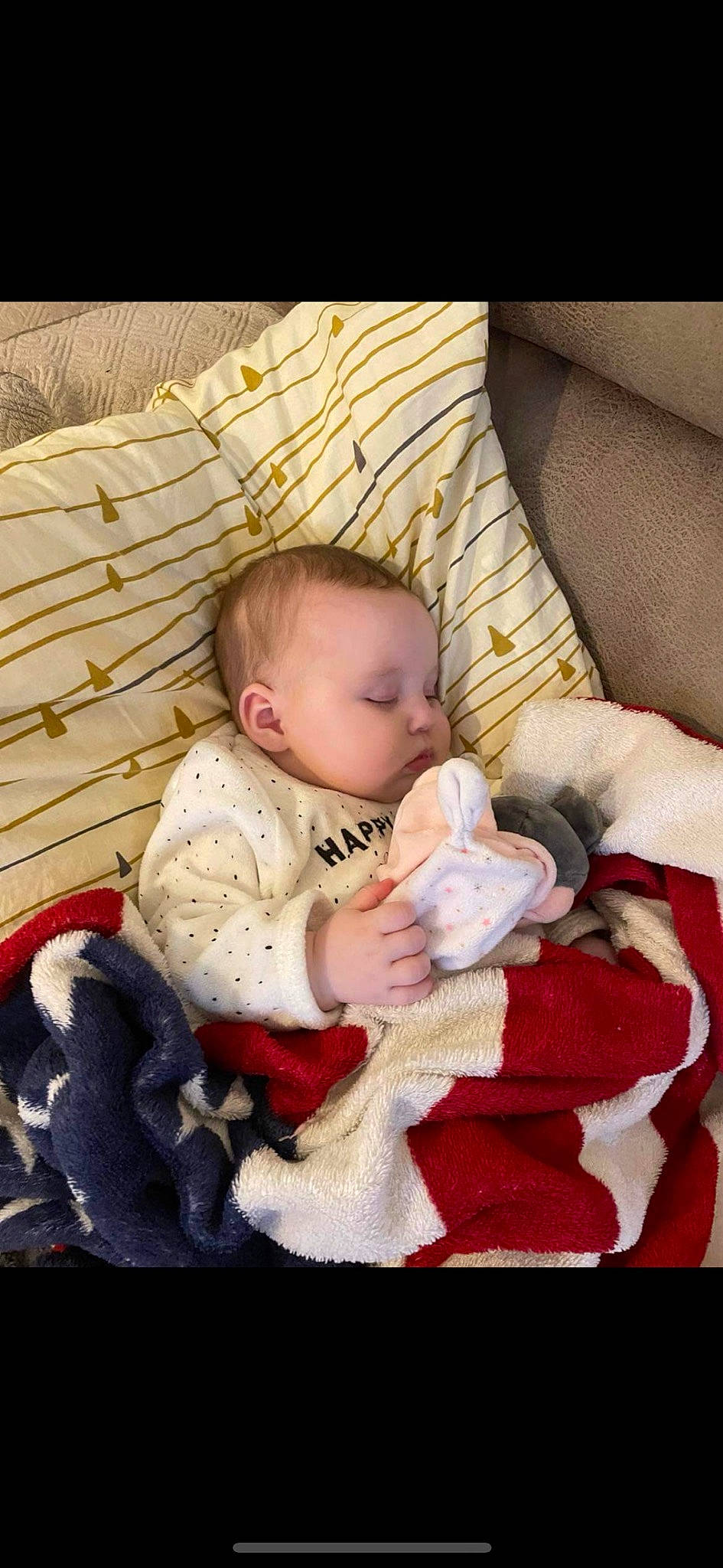 Laya participe au concours pour gagner de l'argent avec cette photo : baby, baby_products, baby_sleeping, baby_toddler_clothing, cheek, child, comfort, couch, fur, head, lap, linens, person, room, sitting, sleeve, textile, toddler, wood