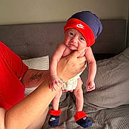 Eric joined the competition — help win amazing prizes! baby, baseballcap, bodypart, cap, clothing, couch, face, finger, furniture, hand, hat, head, hosiery, newborn, person, photography, portrait, shorts, skin, sock