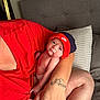 Eric is registered to the contest to win money with this photo: baby, baseballcap, bodypart, cap, clothing, couch, cushion, face, finger, furniture, hand, hat, head, homedecor, newborn, person, photography, portrait, skin, tattoo