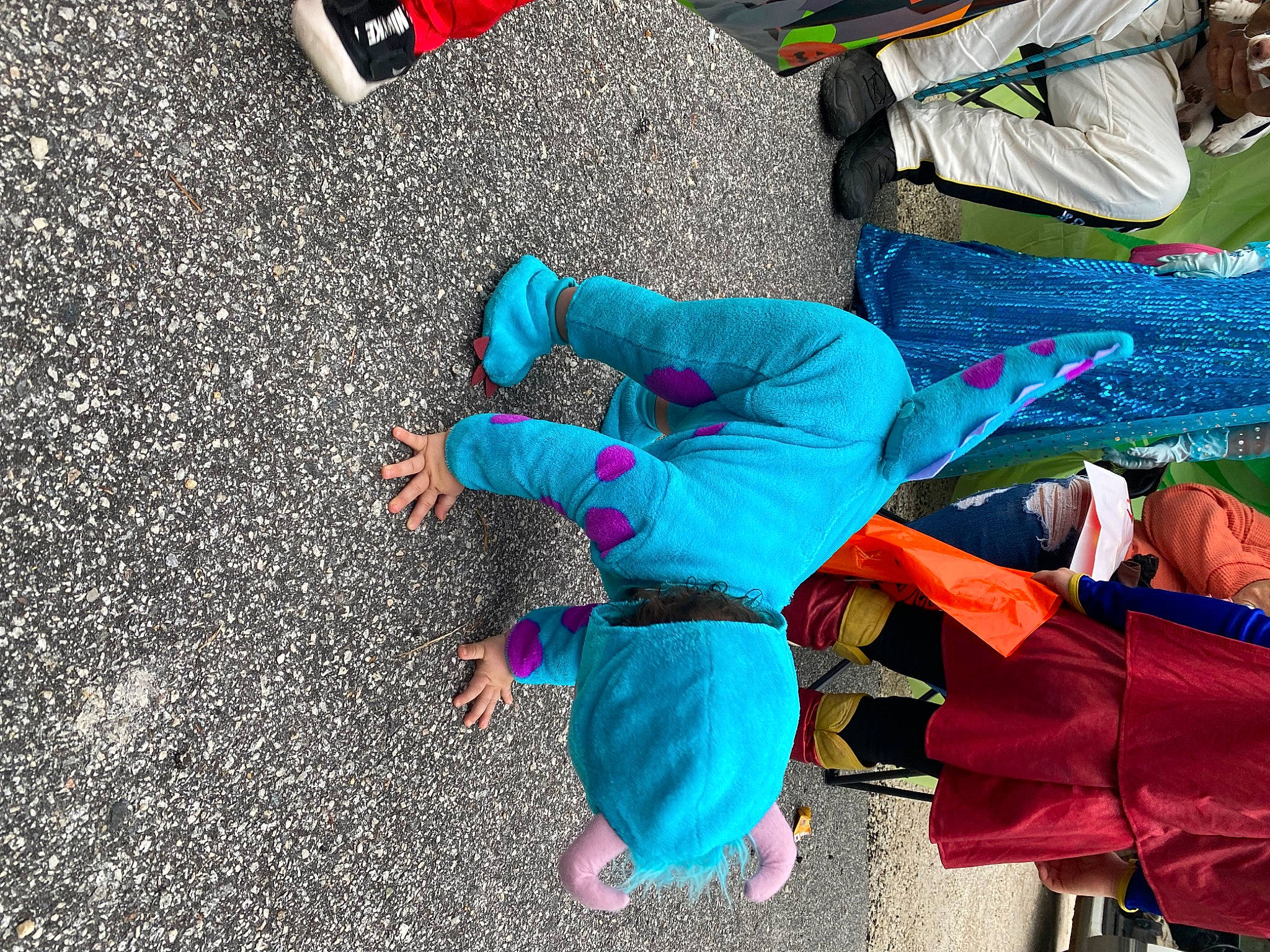 Layton is registered to the contest to win money with this photo: asphalt, bag, blue, child, concrete, electric_blue, event, fun, leisure, person, plastic, recreation, red, road, road_surface, street, tar, toddler, water