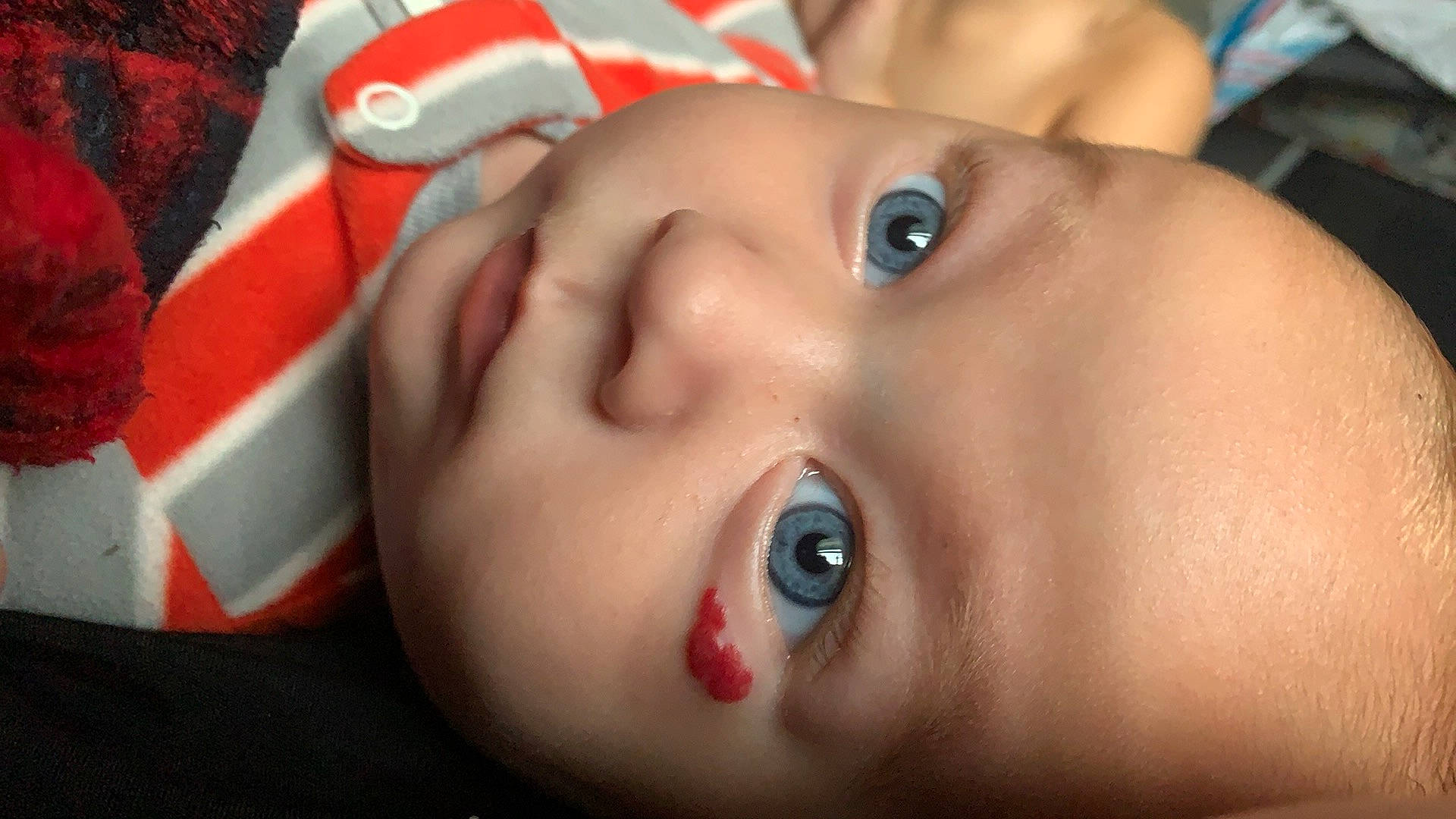 Wolfgang is registered to the contest to win money with this photo: baby, cheek, chin, ear, eye, eyebrow, eyelash, facial_expression, flash_photography, forehead, fun, iris, lip, mouth, neck, nose, person, red, skin, smile