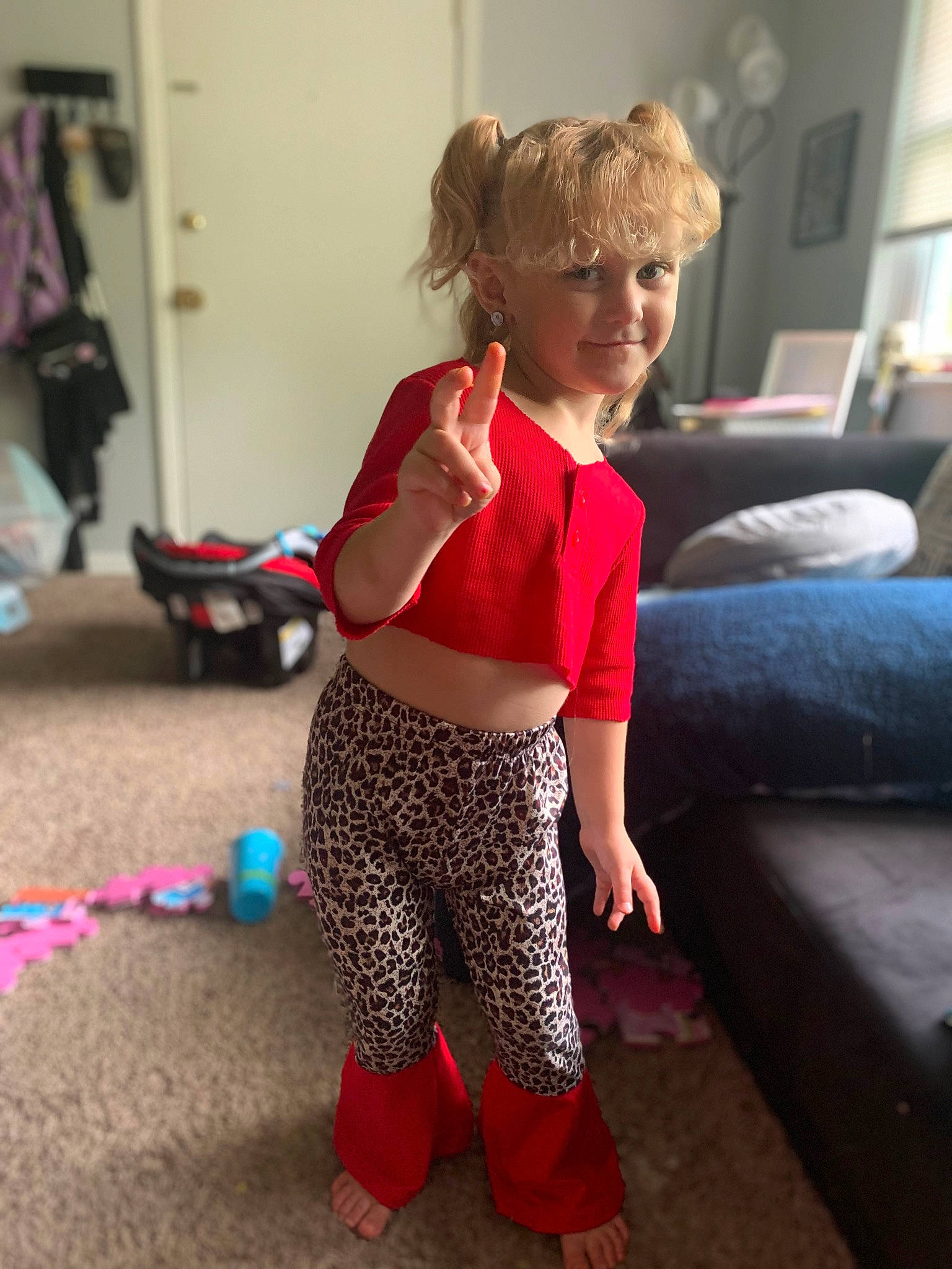 Avonna is registered to the contest to win money with this photo: abdomen, active_pants, couch, denim, electric_blue, floor, flooring, fun, happy, human_leg, joy, knee, long_hair, person, shoulder, sleeve, sportswear, street_fashion, thigh, toddler