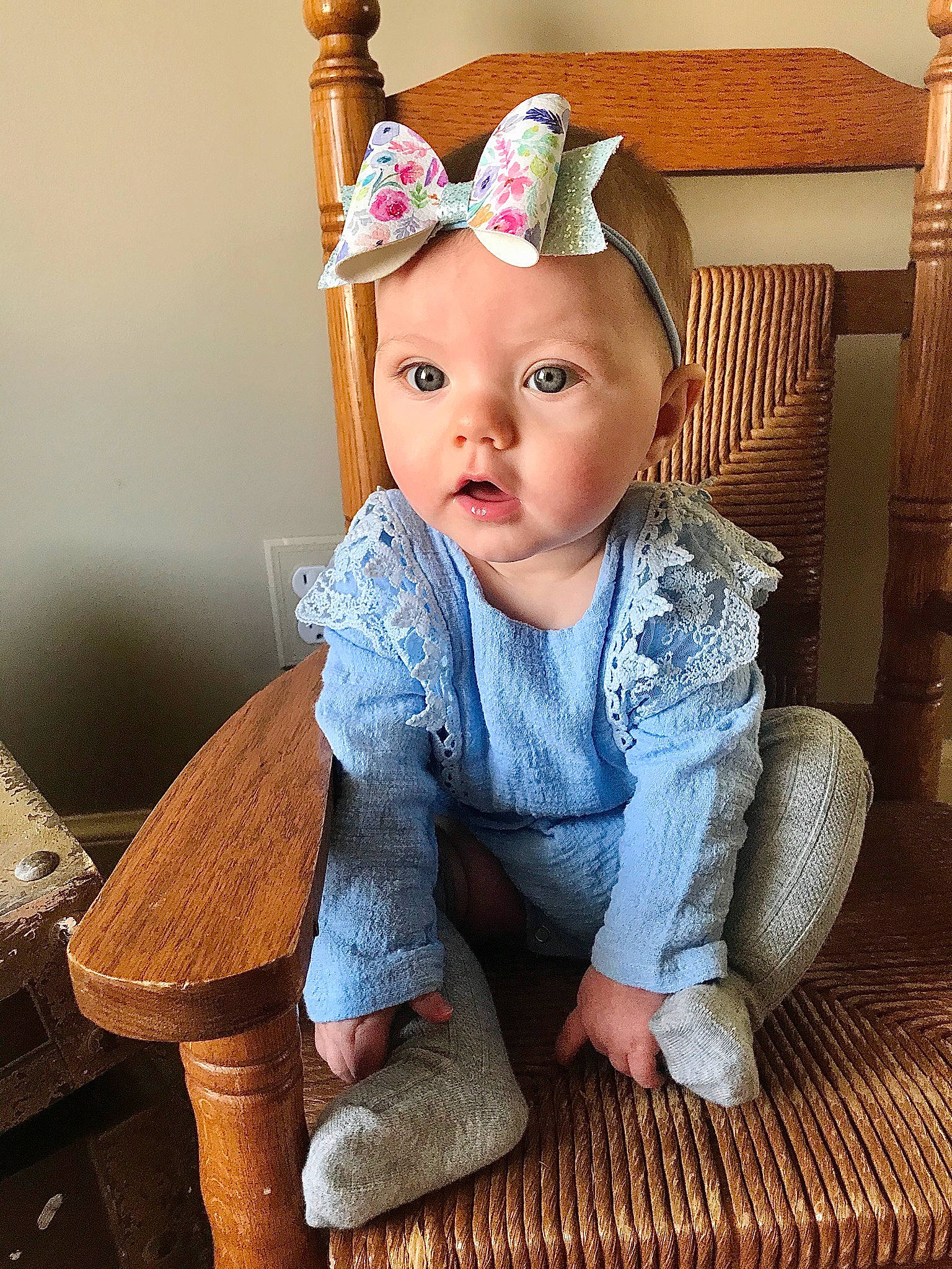 Elle is registered to the contest to win money with this photo: baby, baby_toddler_clothing, child, child_model, ear, fashion_accessory, hair_accessory, headband, headgear, headwear, person, portrait_photography, sitting, toddler