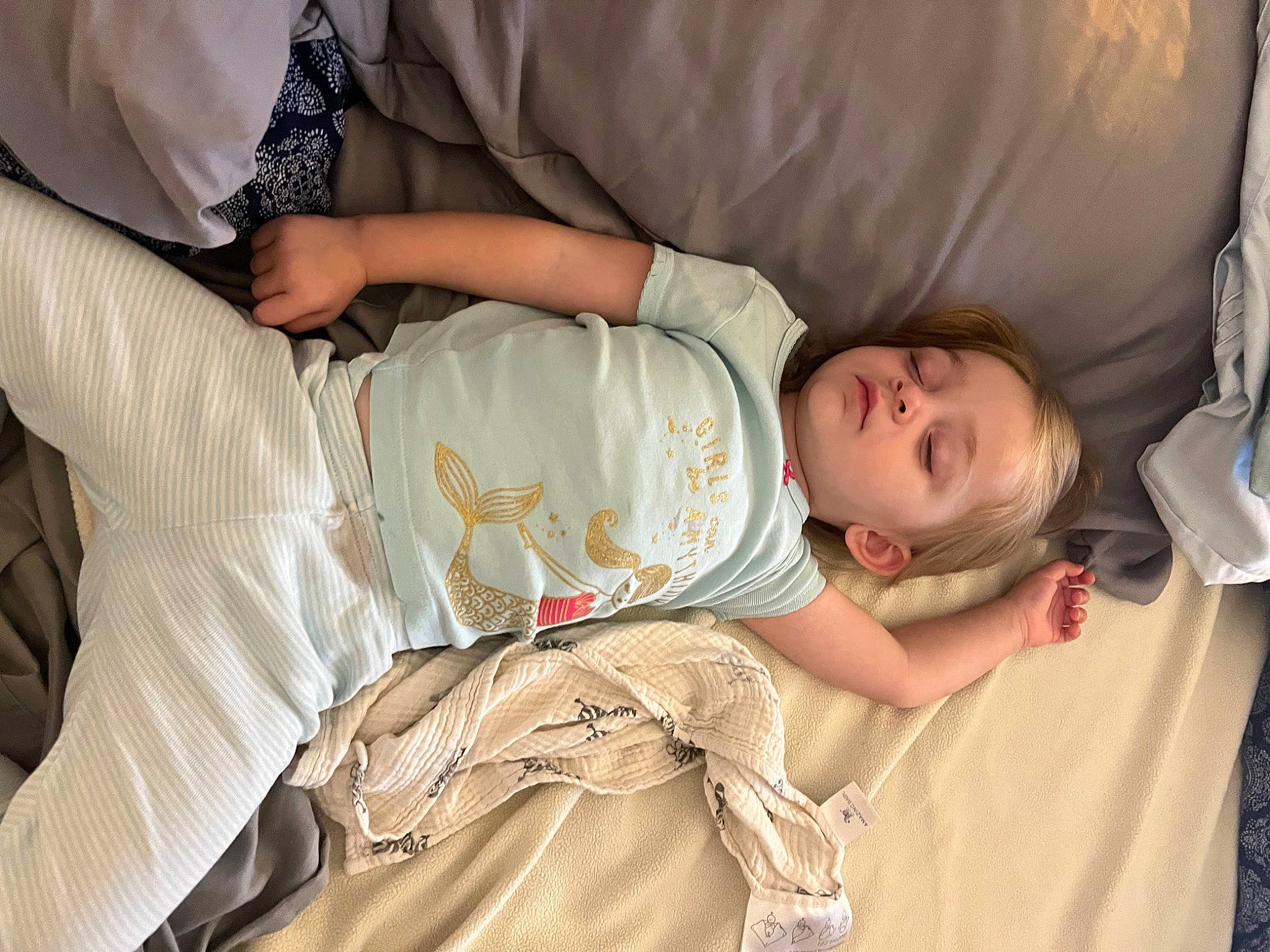 Mckinley is registered to the contest to win money with this photo: baby, baby_products, baby_toddler_clothing, cheek, child, comfort, couch, elbow, gesture, glasses, human_body, joint, linens, mammal, person, product, sitting, skin, sleeve, t_shirt