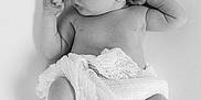 Charles is registered to the contest to win money with this photo: baby, back, bodypart, diaper, face, finger, hand, happy, head, newborn, person, photography, portrait, sleeping, smile, towel, white