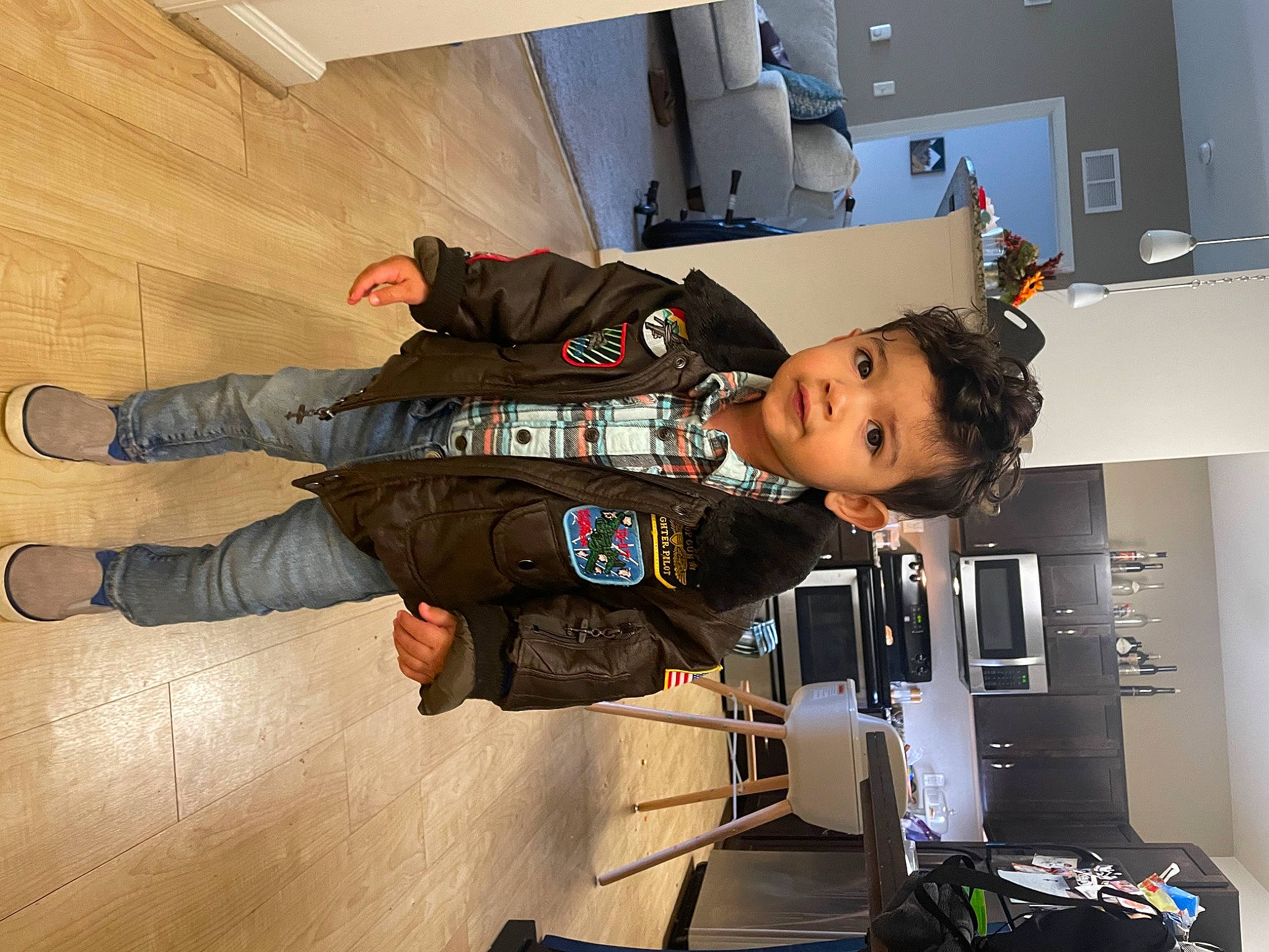 Jacoby is registered to the contest to win money with this photo: child, flooring, fun, hardwood, outdoor_shoe, person, room, sleeve, toddler, wood