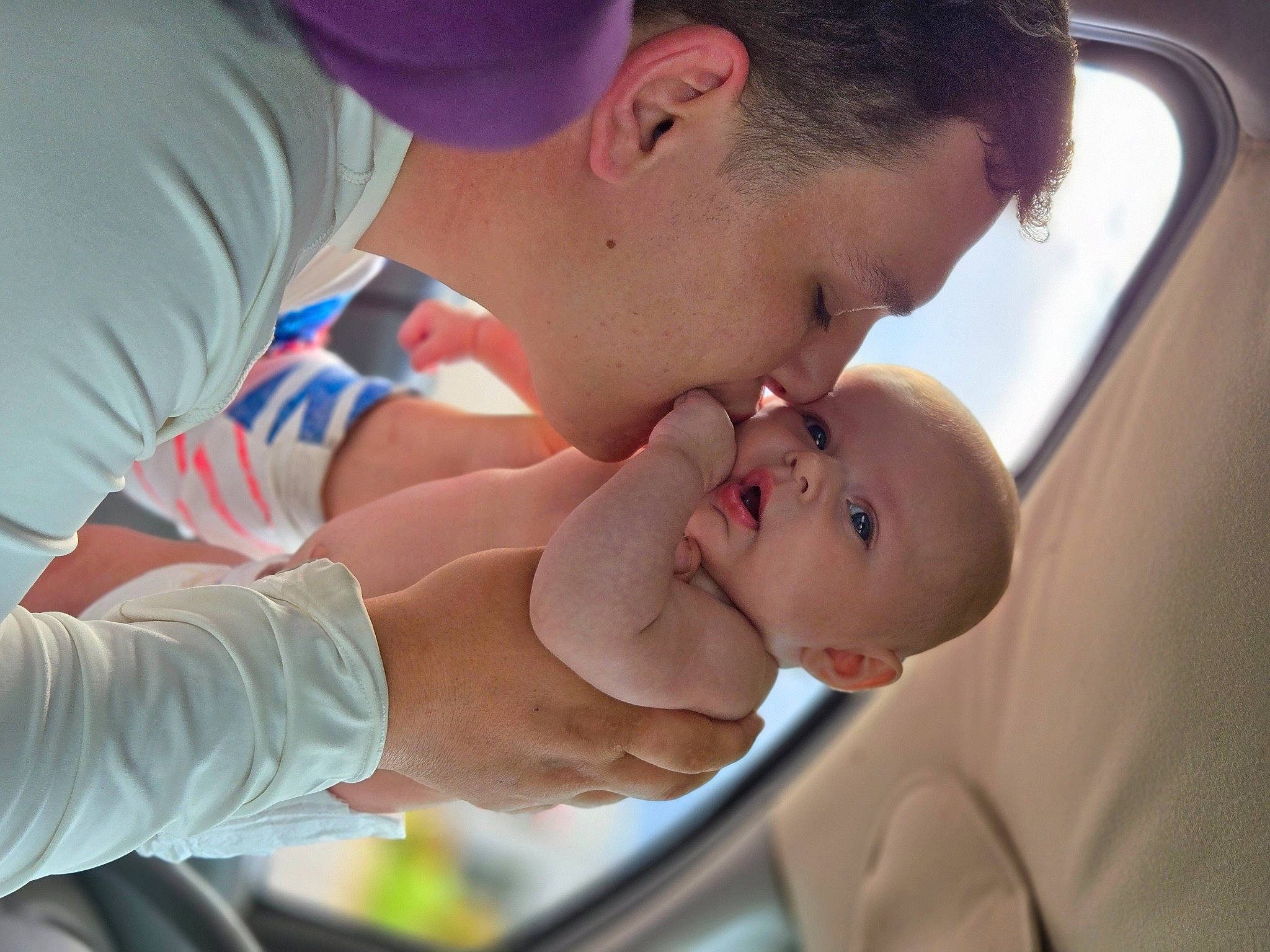 Violet is registered to the contest to win money with this photo: baby, baby_products, baseball_cap, cap, child, ear, elbow, event, fun, gesture, happy, leisure, love, person, sharing, thumb, toddler