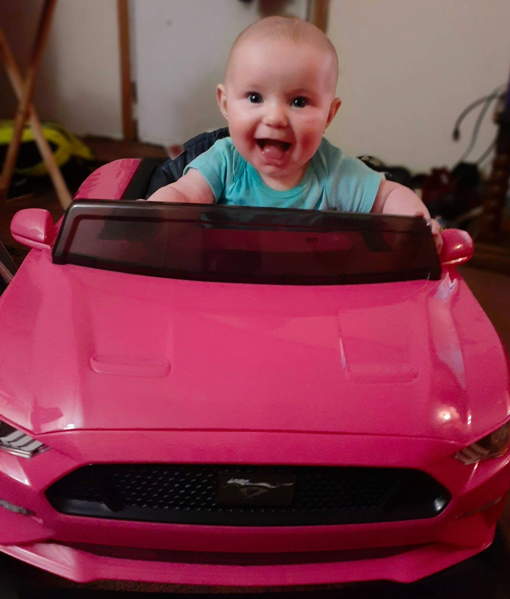 Jurnee is registered to the contest to win money with this photo: automotive_design, automotive_exterior, bumper, car, child, city_car, compact_car, grille, hood, material_property, mid_size_car, person, pink, plant, product, red, smile, subcompact_car, toddler, vehicle