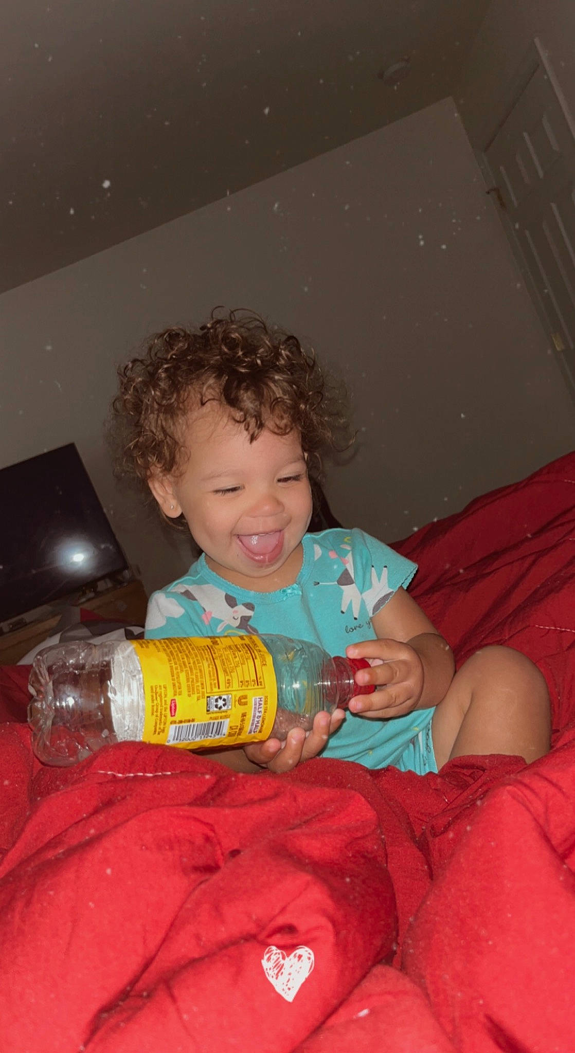 Kyleigh joined the competition — help win amazing prizes! arm, bottle, child, comfort, drink, drinking, drinkware, event, facial_expression, finger, flash_photography, fun, happy, human_body, person, plastic_bottle, sitting, skin, smile, toddler