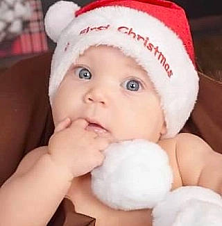 Gianna joined the competition — help win amazing prizes! baby, baby_toddler_clothing, cap, cheek, child, eyebrow, eyelash, face, fashion_accessory, fur, happy, headwear, knit_cap, lip, nail, nose, person, pink, textile, thumb