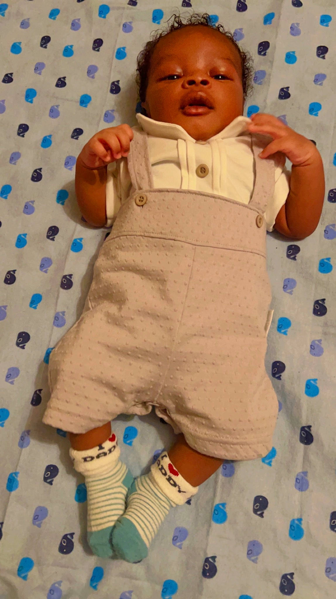 Jason is registered to the contest to win money with this photo: baby, baby_products, baby_safety, baby_sleeping, baby_toddler_clothing, bed_sheet, bedding, blue, child, comfort, happy, linens, pattern, person, room, sleeve, smile, textile, thumb, toddler