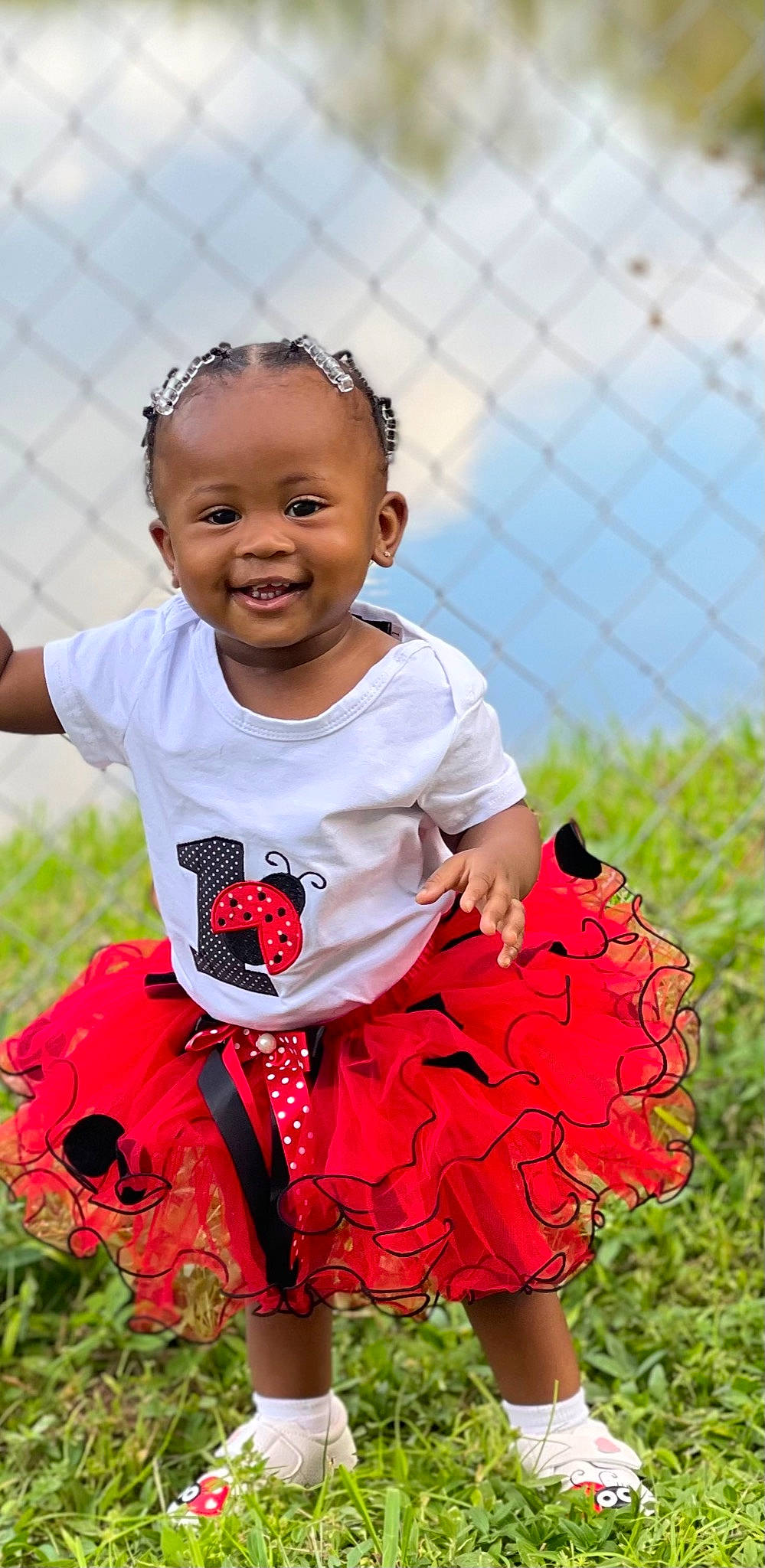 Amiracle is registered to the contest to win money with this photo: baby_toddler_clothing, child, dress, event, face, fun, grass, happy, head, joy, lip, magenta, mesh, person, pink, plant, skin, sky, sleeve, smile