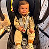Noah participe au concours pour gagner de l'argent avec cette photo : toddler, child, car_seat, smile, fleece_clothing, shoes, socks, toy, stroller, boxes, indoor, face, person, seatbelt, happy, cute, baby, floor, head, clothing