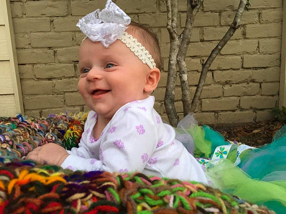 Vivianne is registered to the contest to win money with this photo: child, eye, fun, girl, hair_accessory, happiness, headgear, infant, iris, person, pink, play, product, skin, smile, textile, toddler