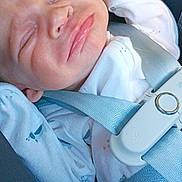 Hunter is registered to the contest to win money with this photo: baby, infant, car_seat, seatbelt, sleeping, pacifier, white_clothing, blue_clothing, closeup, child, infant_clothing, secured, resting, peaceful, transportation, safety, car_interior, young_child, baby_face, child_seat