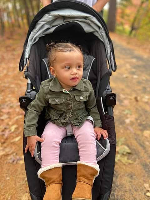 Kamaiyah is registered to the contest to win money with this photo: baby, baby_carriage, baby_carrier, baby_products, child, outerwear, person, play, product, toddler