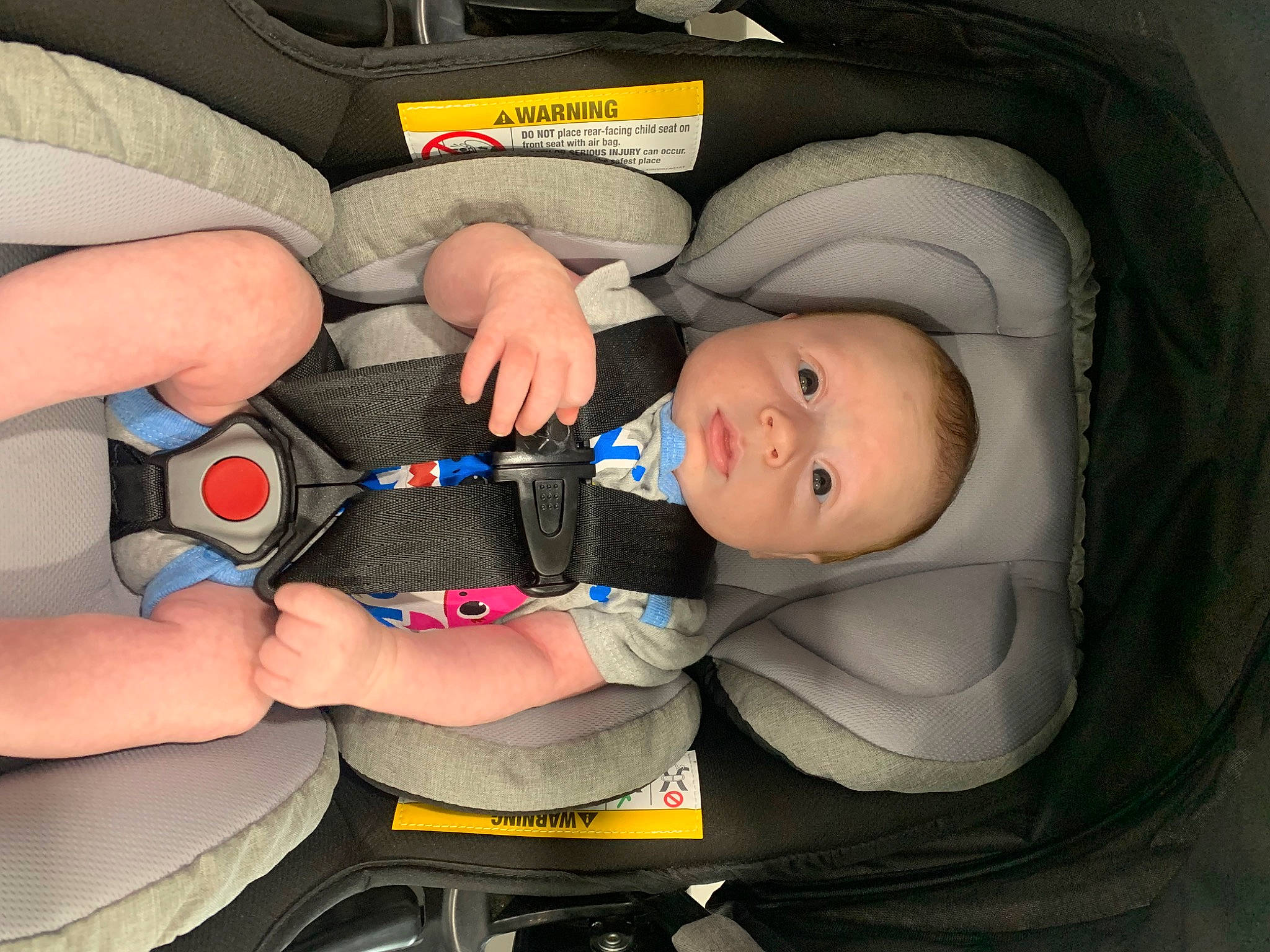 Kian is registered to the contest to win money with this photo: auto_part, baby, baby_carriage, baby_in_car_seat, baby_products, baby_safety, baby_toddler_clothing, car_seat, child, comfort, electric_blue, gesture, human_body, mouth, nail, person, product, service, thumb, toddler