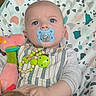Evann participe au concours pour gagner de l'argent avec cette photo : baby, pacifier, toy, plush_toy, blue_eyes, striped_clothing, infant, child, cute, soft_toy, patterned_blanket, closeup, portrait, indoor, hand, face, expression, colorful, comfort, holding