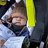 baby, blanket, car_seat, child, child_seat, cozy, cute, face, hat, headwear, indoor, infant, nap, person, receipt, resting, seatbelt, sleeping, soft_toys, warm_clothing
