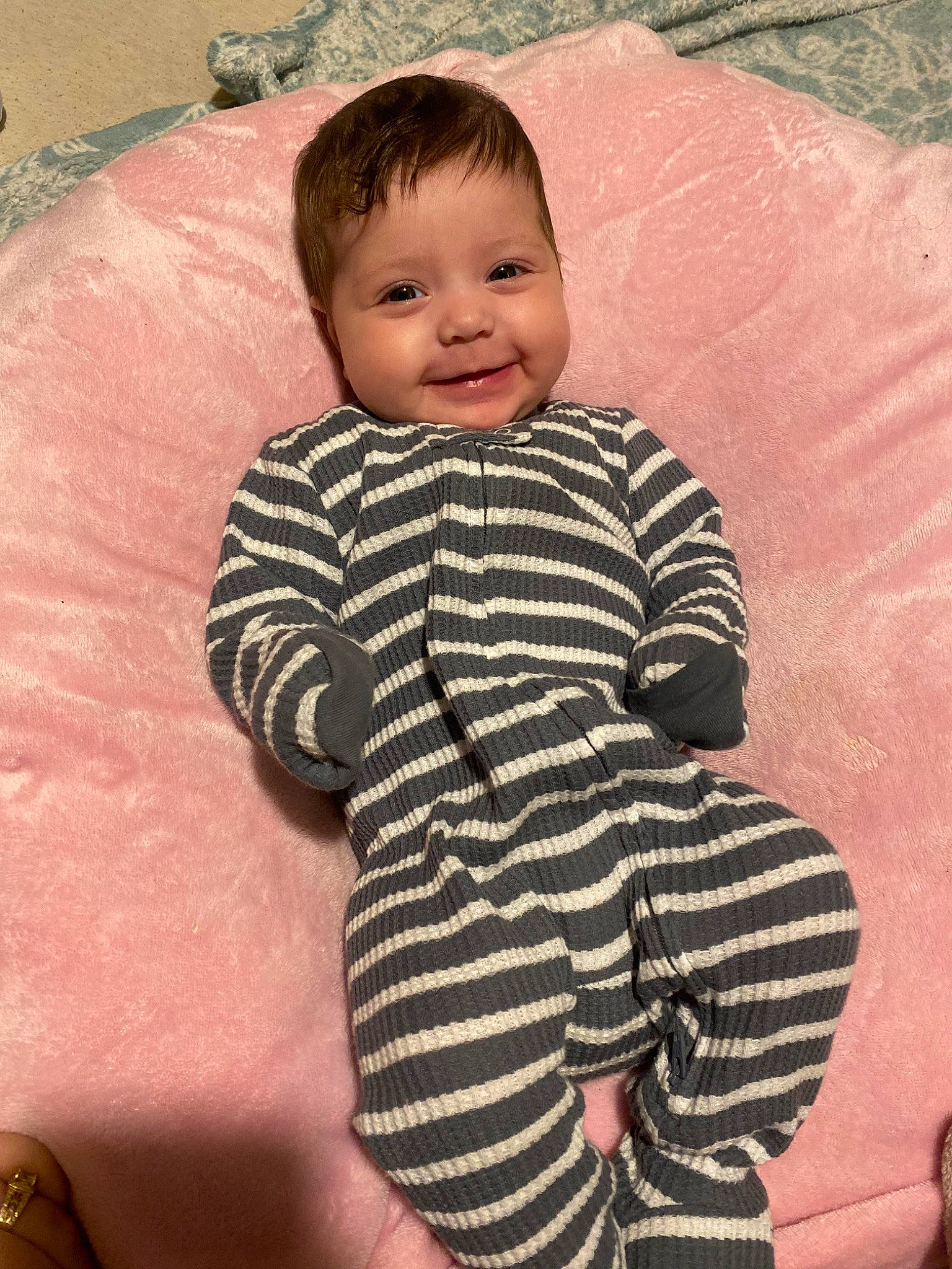 Elisia is registered to the contest to win money with this photo: baby, baby_toddler_clothing, cheek, chin, face, facial_expression, finger, gesture, hairstyle, happy, head, joy, neck, nose, outerwear, person, skin, sleeve, smile, standing