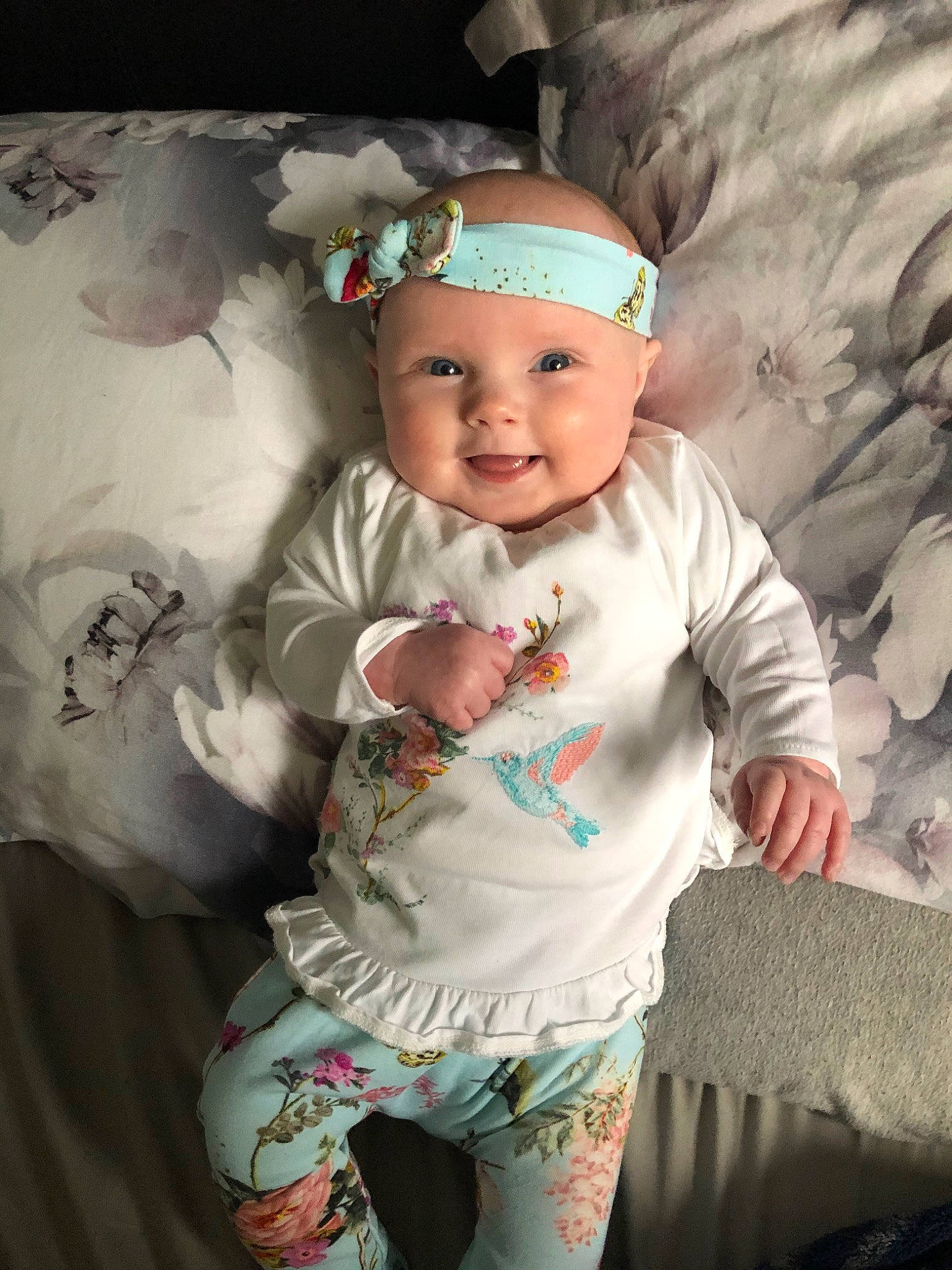 Isla Grace is registered to the contest to win money with this photo: baby, baby_products, baby_toddler_clothing, cheek, child, hair_accessory, headgear, joy, person, product, smile, toddler