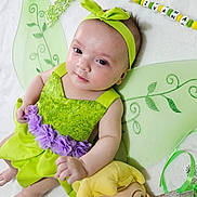 Ivana a rejoint le concours — aidez-le/la à gagner de superbes lots ! baby, child, green_dress, headband, fairy_wings, plush_doll, soft_blanket, purple_flowers, cute, portrait, indoors, smile, happy, toy, costume, close_up, infant, lying_down, face, person