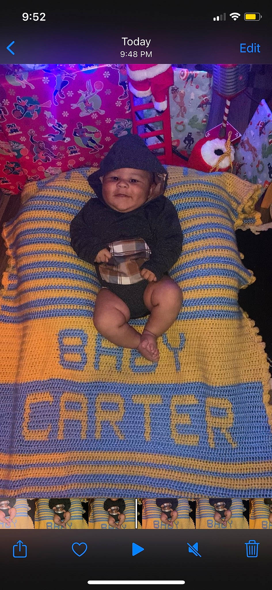 Carter is registered to the contest to win money with this photo: art, blue, child, event, happy, hat, headwear, leisure, linens, pattern, person, pink, purple, room, stuffed_toy, sun_hat, t_shirt, textile, thigh, toddler