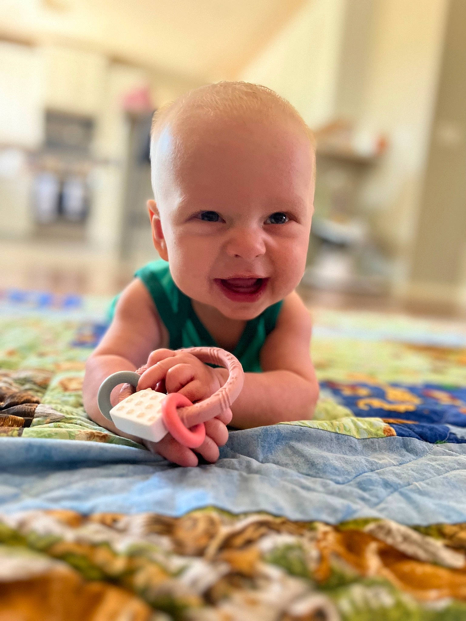 Brooks is registered to the contest to win money with this photo: baby, baby_playing_with_toys, baby_toddler_clothing, cheek, eye, floor, flooring, foot, fun, happy, head, nail, people_in_nature, person, skin, smile, thumb, toddler, toy, tummy_time