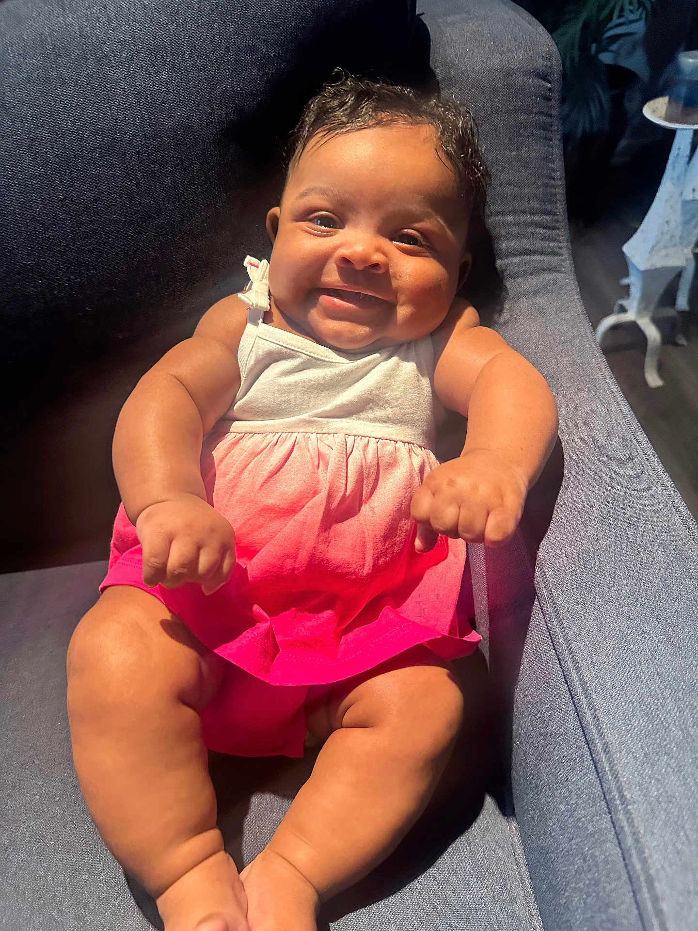 Alaniela is registered to the contest to win money with this photo: baby, child, smiling, dress, pink, white, armchair, happy, infant, sitting, cute, indoors, furniture, skin, legs, person, portrait, sunlight, cozy, comfortable
