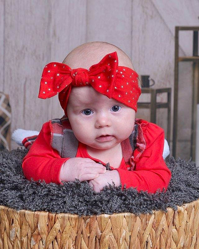 Aubrey is registered to the contest to win money with this photo: baby, baby_toddler_clothing, cap, child, chin, costume_hat, eye, facial_expression, fun, grass, happy, headgear, headwear, knit_cap, lip, pattern, person, red, sleeve, toddler