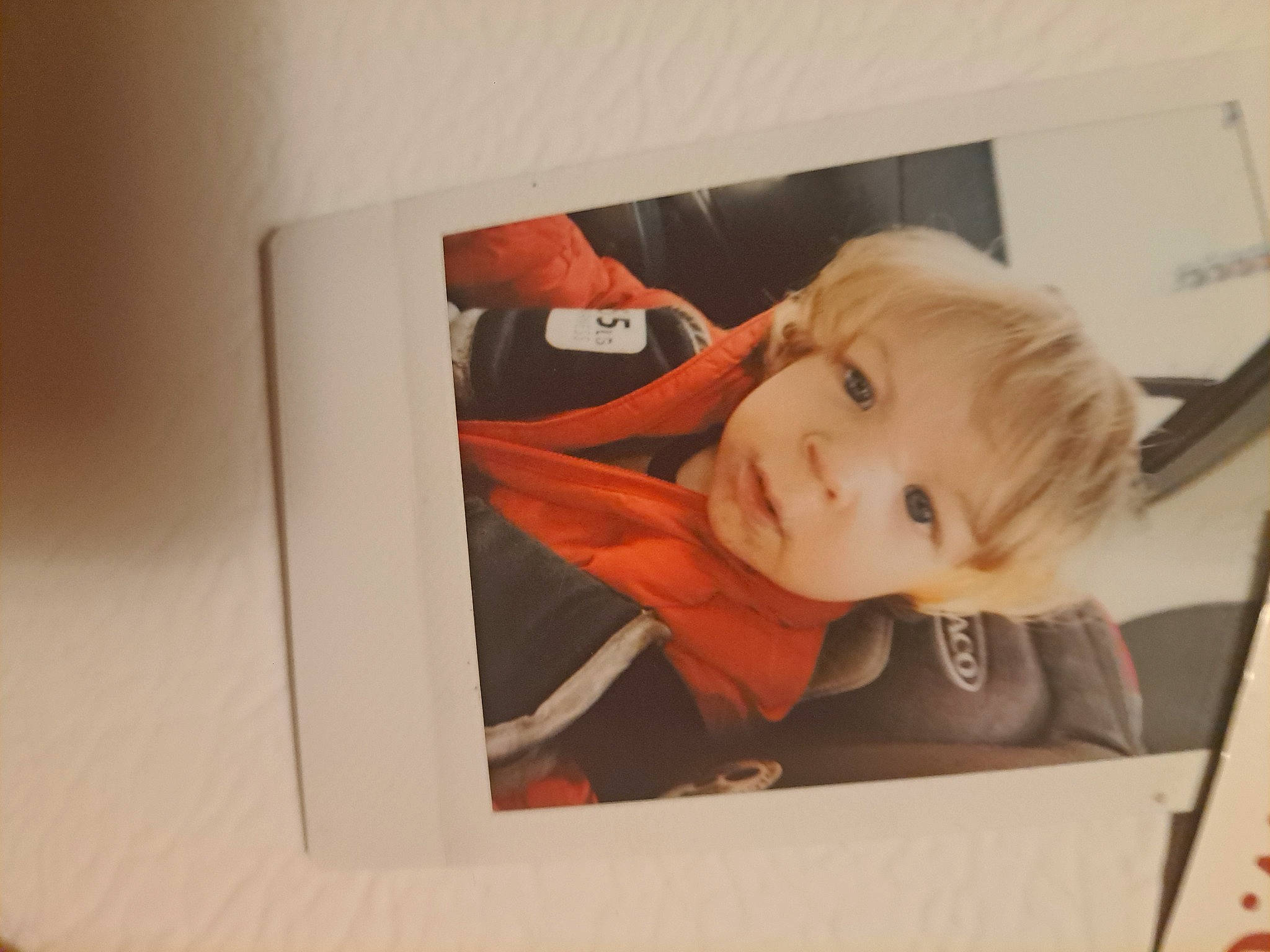 Draco is registered to the contest to win money with this photo: baby, baby_products, baby_toddler_clothing, cheek, child, comfort, flooring, fun, person, room, smile, toddler, wood