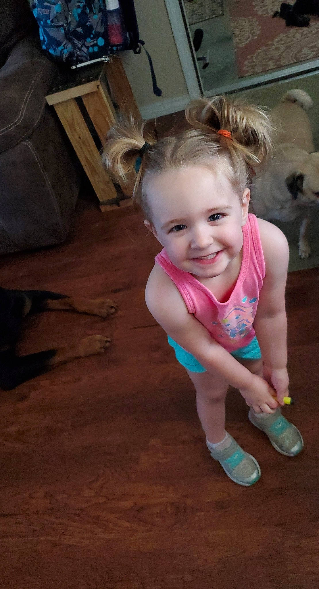 Jada is registered to the contest to win money with this photo: baby_toddler_clothing, cabinetry, eye, floor, flooring, foot, fun, hairstyle, happy, hardwood, human_leg, joint, joy, leisure, person, sitting, skin, smile, sock, television