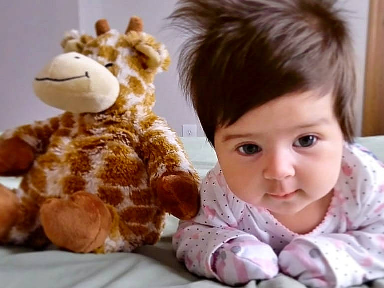 Natalie joined the competition — help win amazing prizes! baby, child, ear, giraffe, giraffidae, happy, person, play, plush, smile, stuffed_toy, teddy_bear, textile, toddler, toy