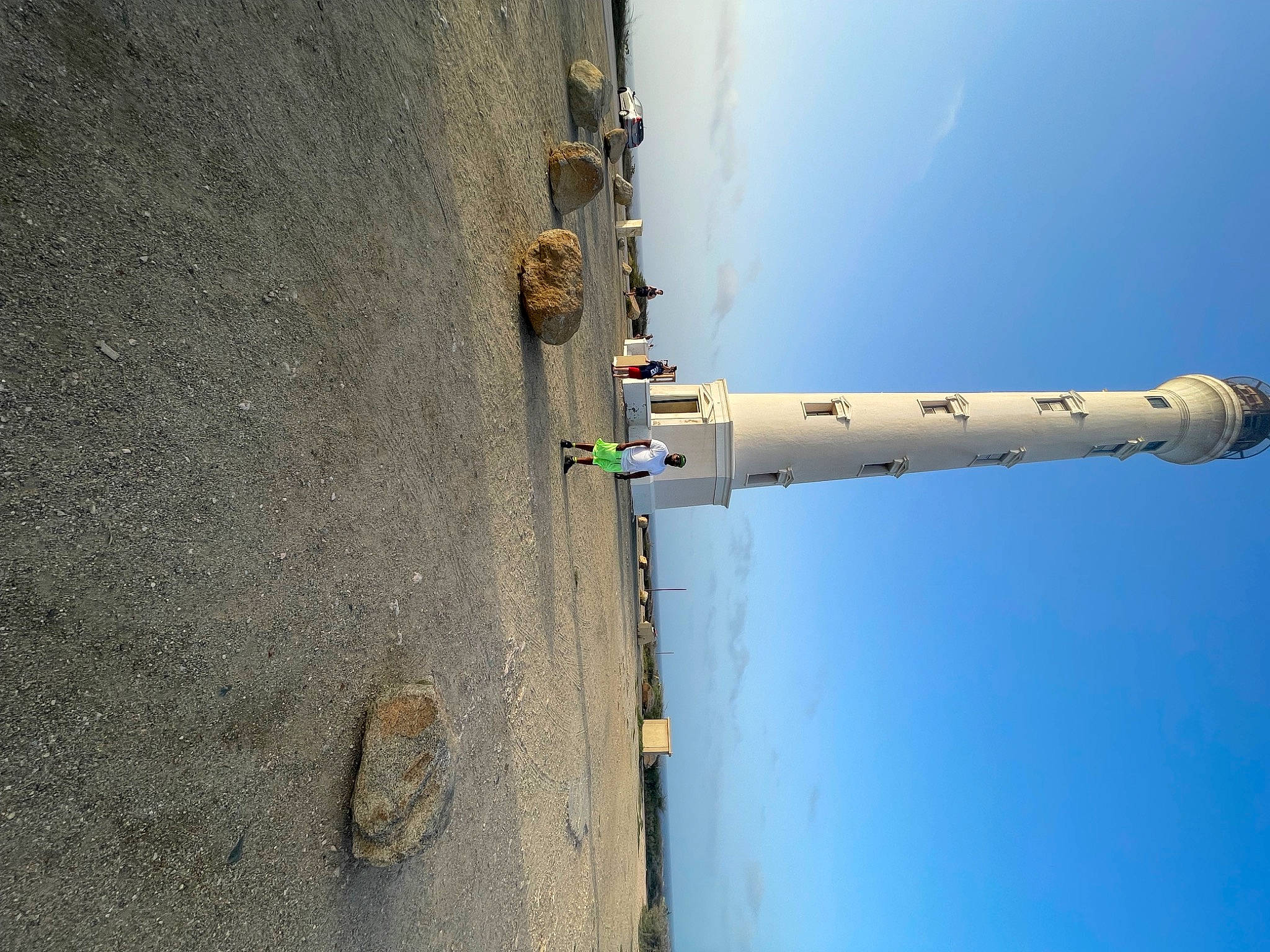 Kayden is registered to the contest to win money with this photo: art, building, composite_material, concrete, cylinder, engineering, gas, lighthouse, metal, person, pipe, public_utility, sky, tower, under_exposed, water, wood