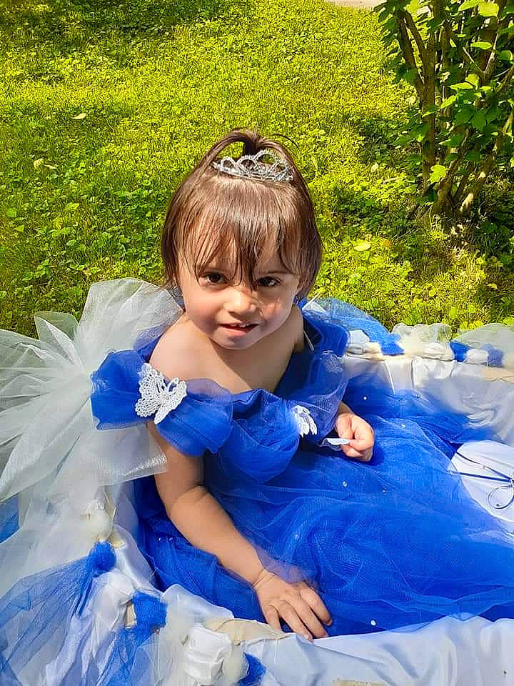 Kyleigh is registered to the contest to win money with this photo: azure, blue, botany, bridal_clothing, dress, eye, facial_expression, gown, grass, green, hairstyle, happy, head, iris, joy, people_in_nature, person, plant, shoulder, summer