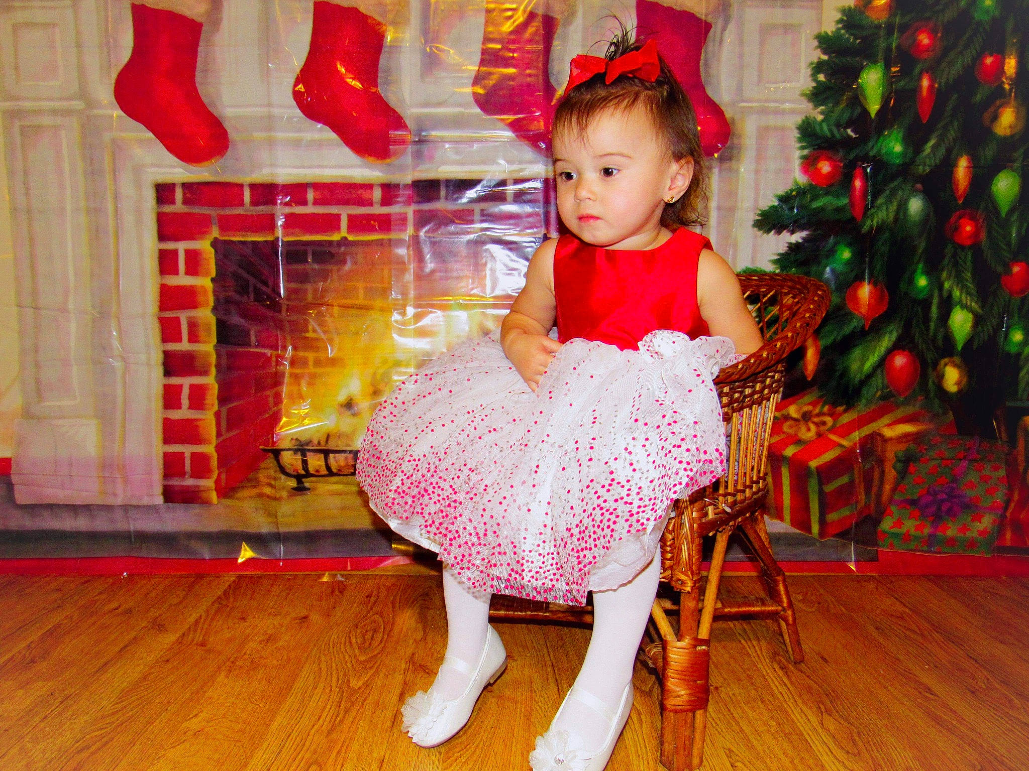 Kyleigh joined the competition — help win amazing prizes! baby_toddler_clothing, beauty, christmas_tree, embellishment, event, face, flooring, fun, happy, hardwood, holiday, lap, magenta, pattern, person, pink, red, sitting, sleeve, toddler